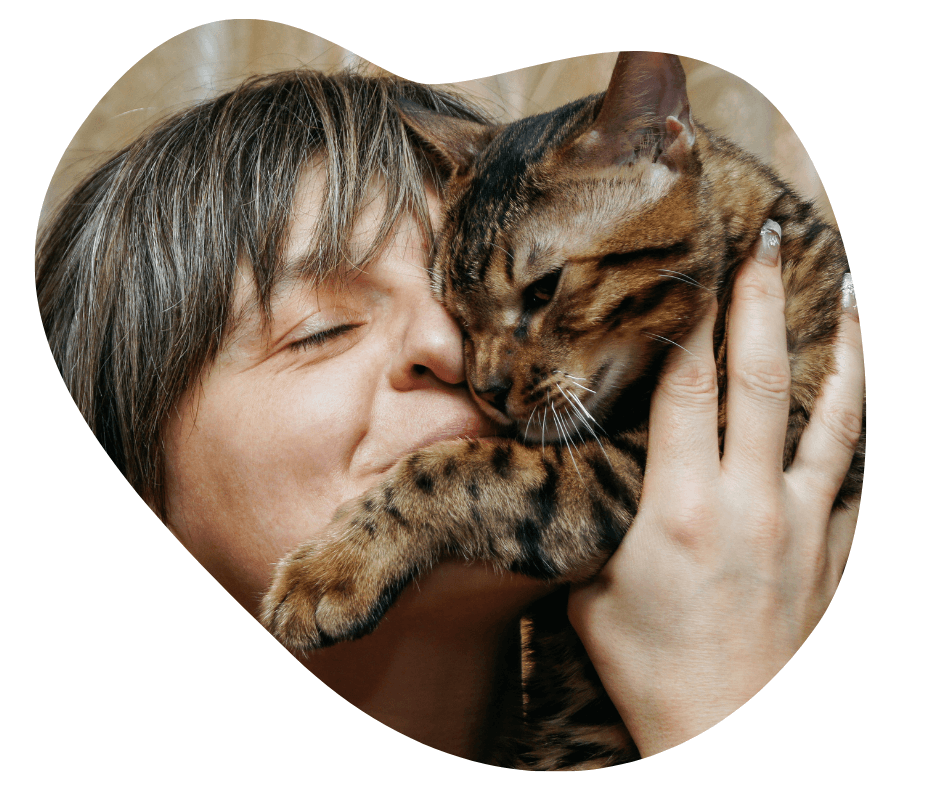 woman hugging a cat